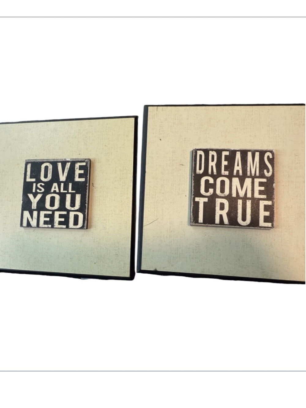 inspirational wall plaques feature distressed black typography on a white